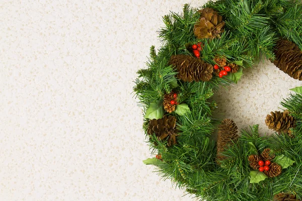 Christmas wreath on a white wall — Stock Photo, Image