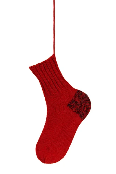 Knitted red sock on the cord — Stock Photo, Image