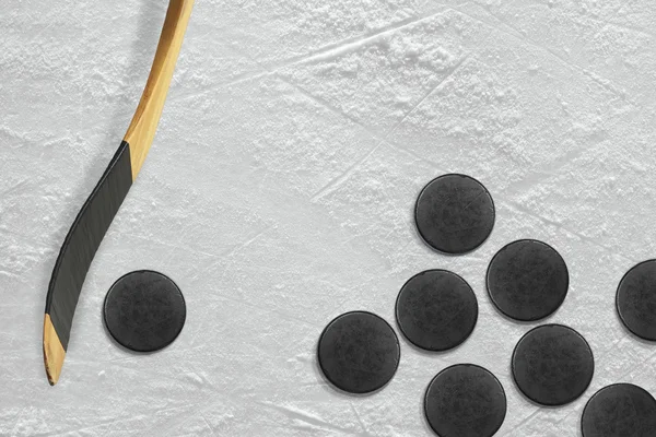 Hockey stick and puck on the ice — Stock Photo, Image