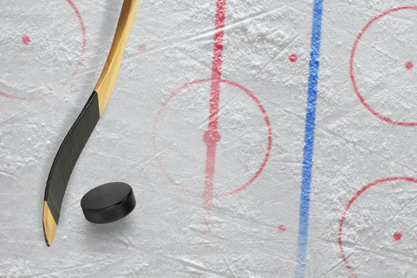 Stick, puck and hockey field — Stock Photo, Image