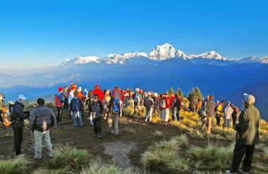 Tourists meet the sunrise at top of Poon Hill in Himalayas, Nepal clipart