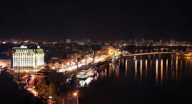 KYIV, UKRAINE - SEPTEMBER 16, 2012: View to Podil district of Kyiv city in the night. Panorama