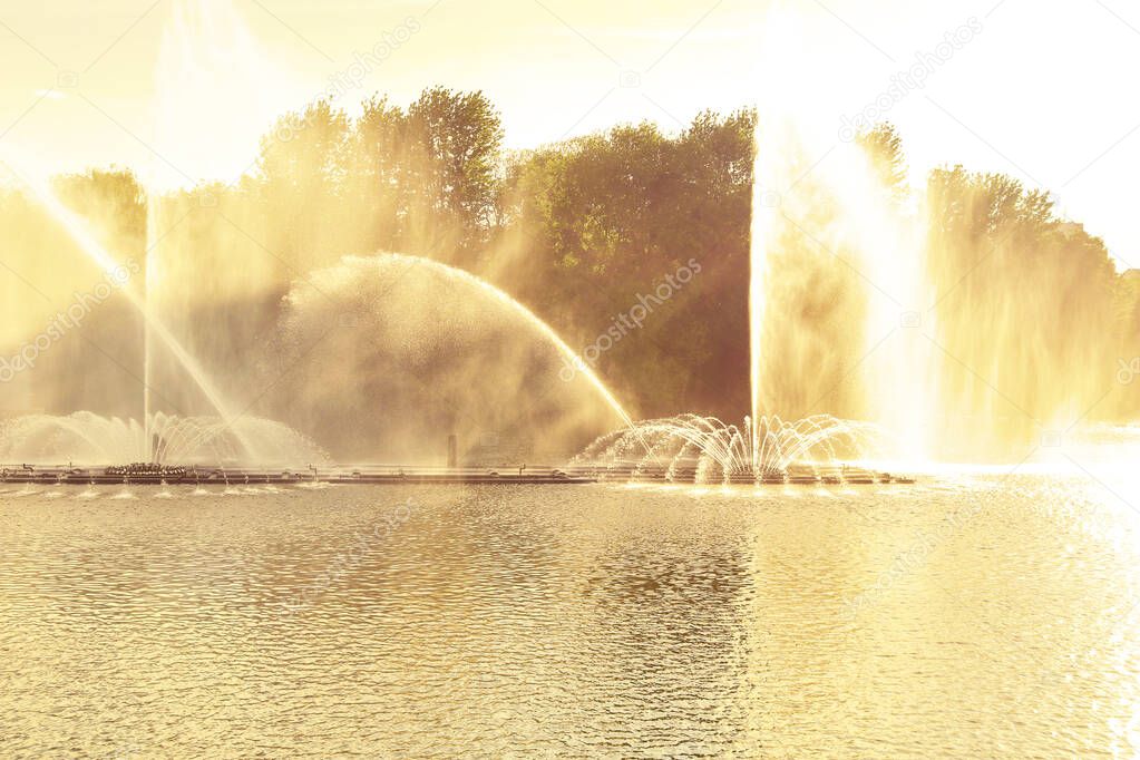 Picturesque sunset view on multimedia floating fountain on the Southern Buh River in Vinnytsia, Ukraine. Golden hours