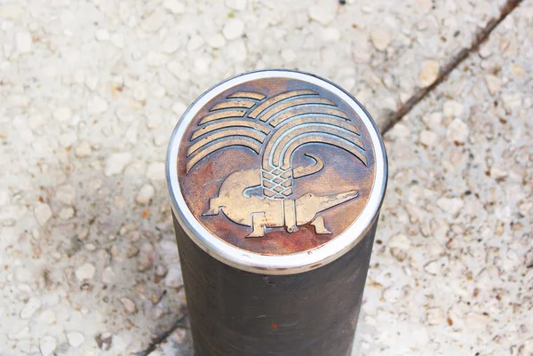 Nimes symbol on top of a metal pole, Nimes, France Royalty Free Stock Images