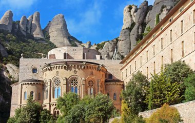 Montserrat Monastery is a beautiful Benedictine Abbey high up in the mountains near Barcelona, Spain clipart