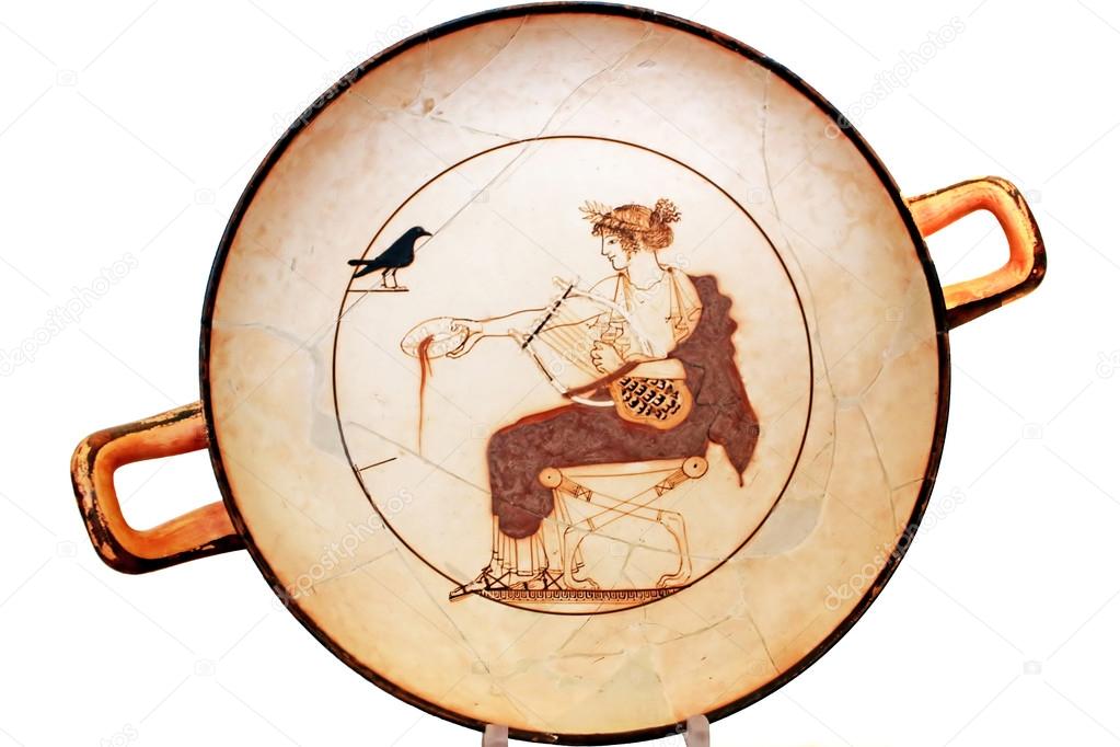 Ancient Greek plate on white in Delphi, Greece. Tondo of an Attic white-ground kylix from a tomb (probably that of a priest)