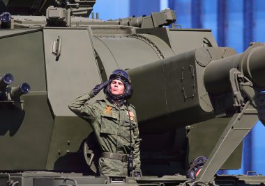 Artilleryman at the military parade clipart