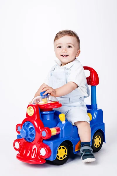Bebé niño con un camión de juguete — Foto de Stock