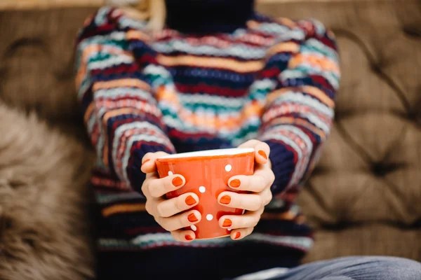 Woman  holding a cup of warm drink — Stock Photo, Image