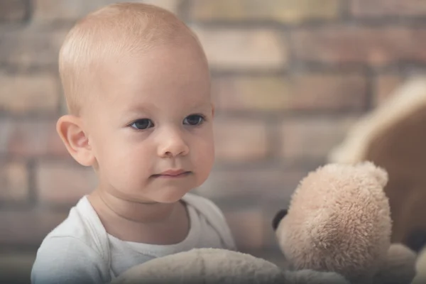 Cute baby girl in light clothes — Stock Photo, Image