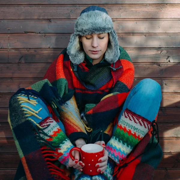 Young woman covered in plaid — Stock Photo, Image