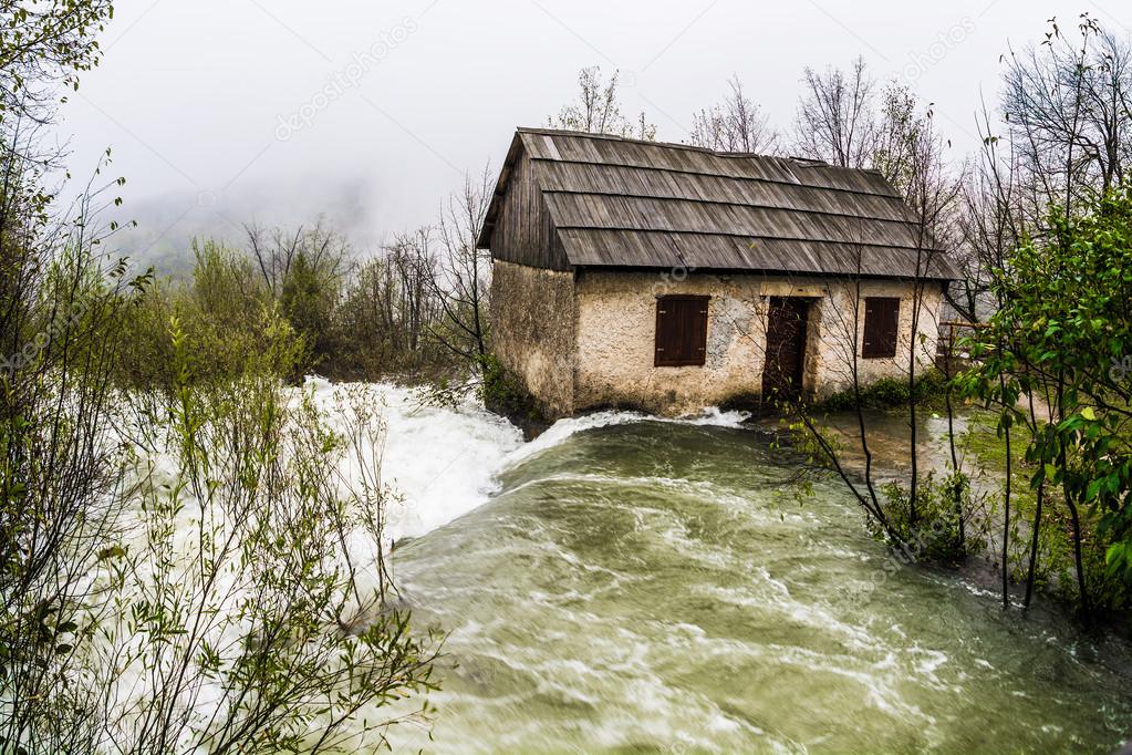 Flood, abandoned house washed away