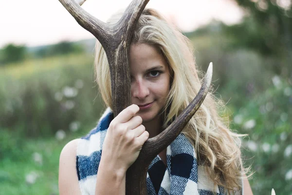 Woman holding antler — Stock Photo, Image