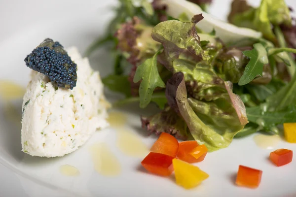 Fresh salad and ricotta with bue caviar — Stock Photo, Image