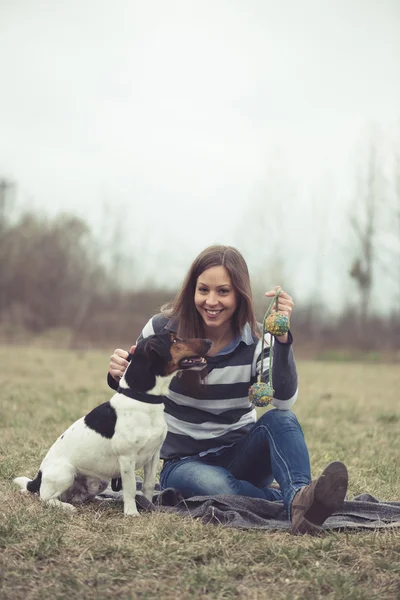 Woman having fun with her dog — Stock Photo, Image