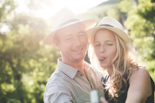 Lovely couple taking self portrait outdoor — Stock Photo, Image