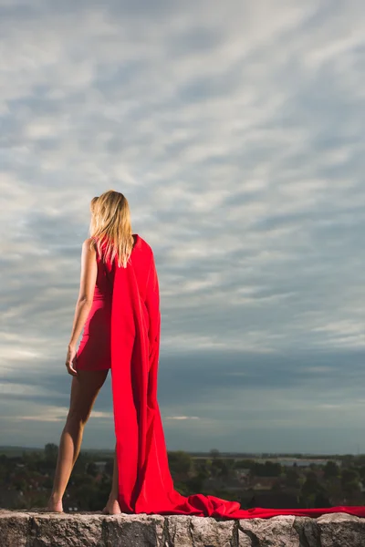 Young woman posing as superhero or wonderwoman — Stock Photo, Image