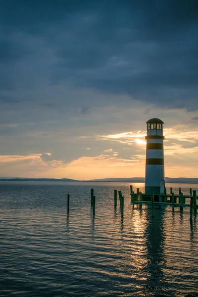 Seascape at sunset. Lighthouse — Stock Photo, Image