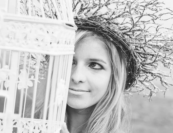 Fairy woman holding birdcage outdoor — Stock Photo, Image