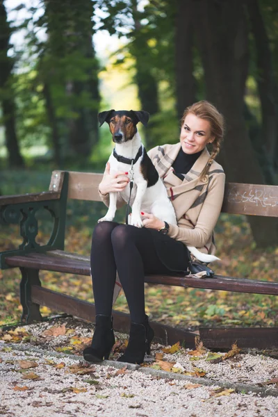 Young woman and   cute dog — Stok fotoğraf