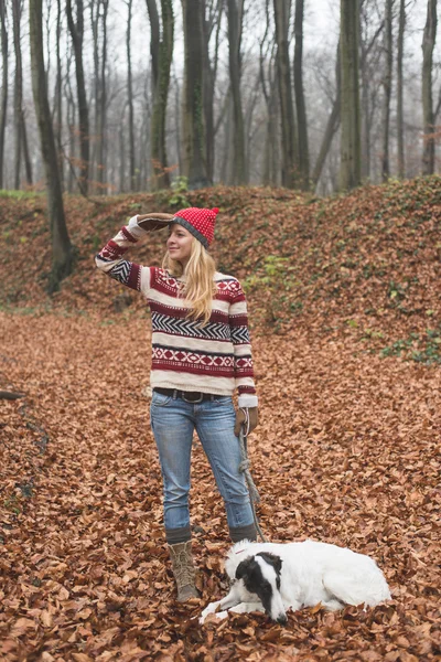 Woman with Borzoi dog in autumn forest — ストック写真