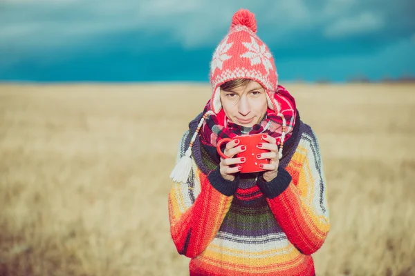 Nomad woman drinking hot beverages