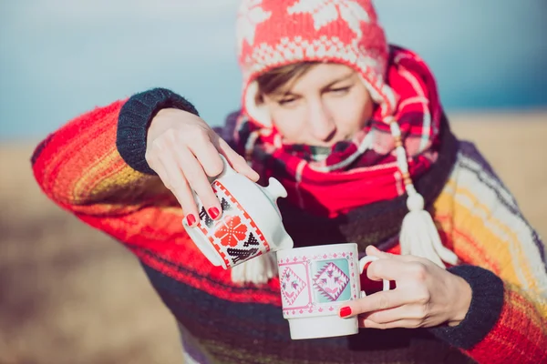 Winter girl drinking tea or coffee — Stok fotoğraf