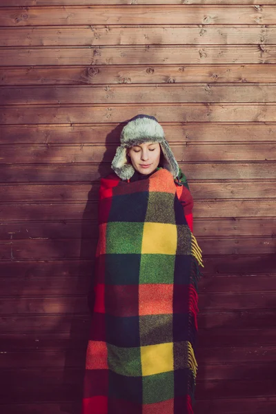 Young woman under a warm blanket — Stock Photo, Image