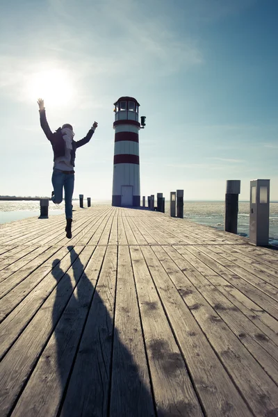 Happy, carefree woman jumping up outdoor — Stock Photo, Image