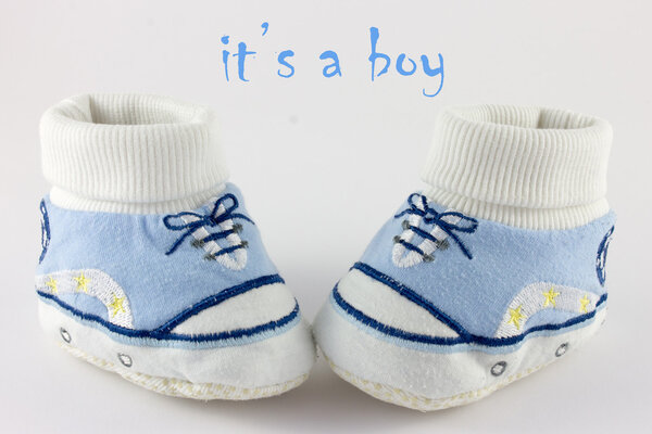 Baby stuff and shoes isolated on white