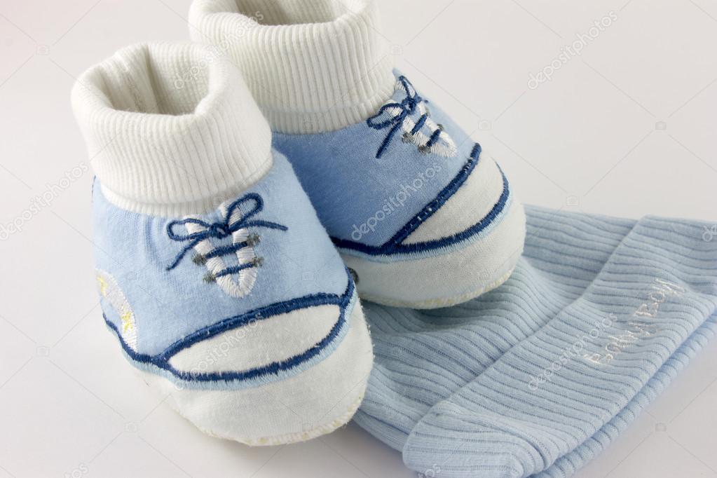Baby stuff and shoes isolated on white