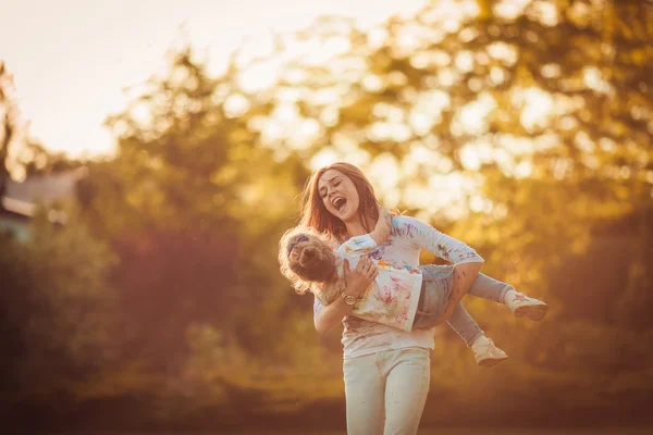 Mother and little daughter playing together — Stock Photo, Image