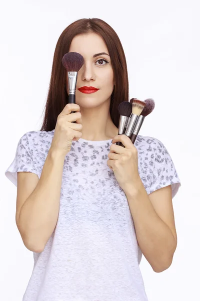 Portrait of woman with brushes — Stock Photo, Image