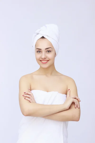 Young beautiful woman wrapped in towel — Stock Photo, Image