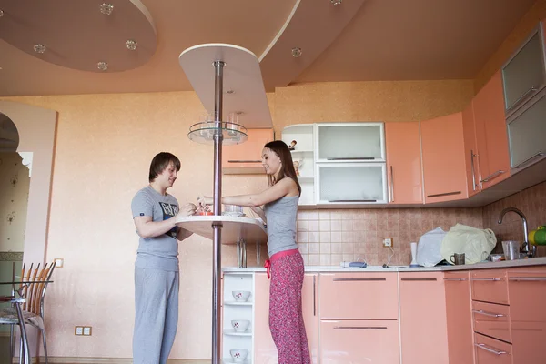 Happy couple in kitchen — Stock Photo, Image