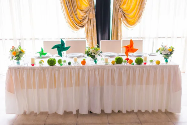 Tables decorated with flowers and fruit — Stock Photo, Image