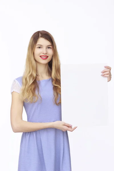 Happy woman holding white blank paper — Stock Photo, Image