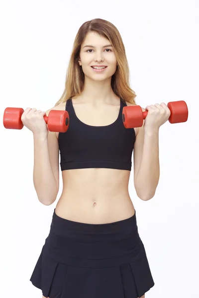 Shot of a sporty young woman with dumbbells. — Stock Photo, Image