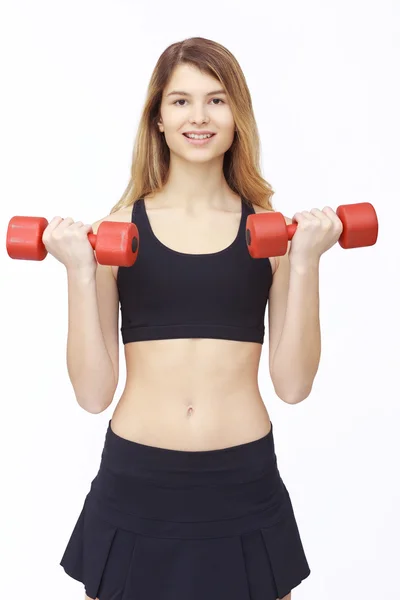 Foto de una joven deportista con mancuernas . —  Fotos de Stock