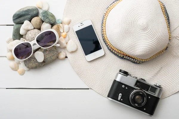 Beach accessories on wooden board