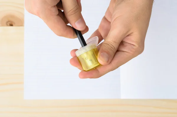 Top view of mans hands sharpening pencil — Stock Photo, Image