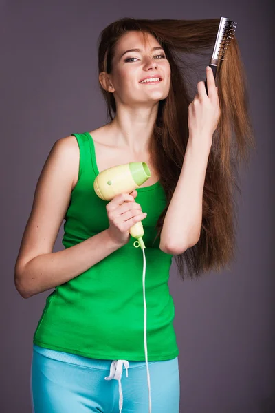 Mujer con secador de pelo — Foto de Stock