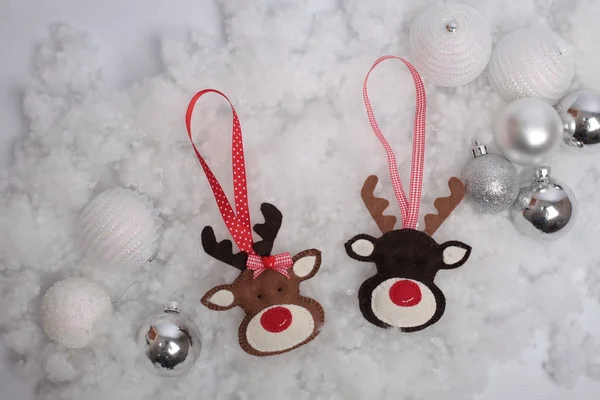 Christmas deer and balls on snow — Stock Photo, Image