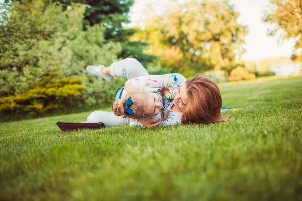 Mother and little daughter playing together — Stock Photo, Image