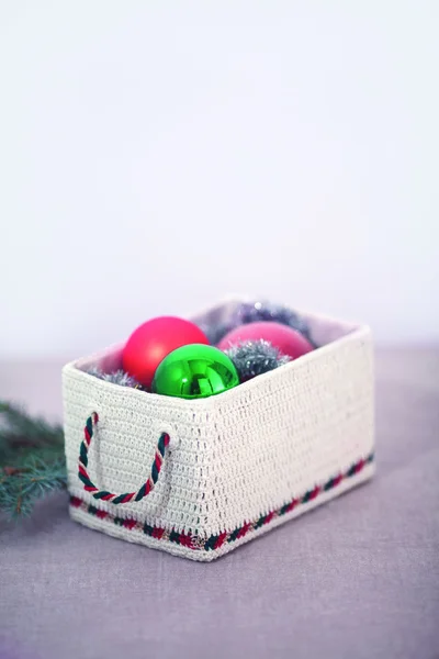 Holiday knitted box with balls — Stock Photo, Image