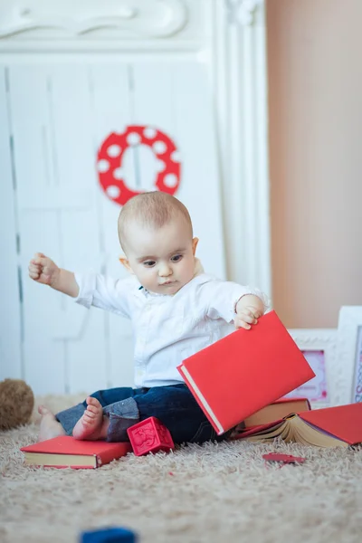 Funny baby with books — Stock Photo, Image