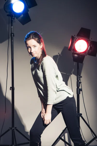 Woman posing in light flashes — Stock Photo, Image