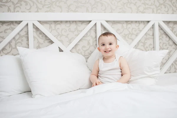 Cute baby boy in bed — Stock Photo, Image