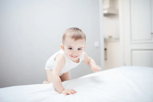 Cute baby boy in bed — Stock Photo, Image