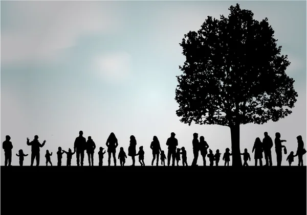 Silhouettes familiales dans la nature . — Image vectorielle